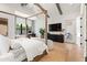 Bedroom with wood flooring, designer fixtures and an office setup near the window at 4708 N 41St Pl, Phoenix, AZ 85018