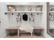 Mudroom with bench seating, storage baskets, and coat hooks for organization at 4708 N 41St Pl, Phoenix, AZ 85018