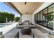 Inviting outdoor lounge area featuring a comfortable sofa and a ceiling fan for relaxing at 4708 N 41St Pl, Phoenix, AZ 85018