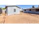 Backyard featuring a shed with decorative trim, providing extra storage space at 4740 W Bloomfield Rd, Glendale, AZ 85304