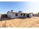 Back exterior showing patio and satellite dish at 4740 W Bloomfield Rd, Glendale, AZ 85304