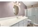 Bathroom featuring single sink vanity and a shower with a sliding door at 4740 W Bloomfield Rd, Glendale, AZ 85304