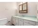 Bathroom vanity with a sink, mirror cabinet, and white cabinets at 4740 W Bloomfield Rd, Glendale, AZ 85304