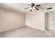 Bedroom with a ceiling fan and carpet flooring, and a closet with louvered doors at 4740 W Bloomfield Rd, Glendale, AZ 85304