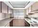 Kitchen showcasing cabinetry, laminate countertops, and double basin sink at 4740 W Bloomfield Rd, Glendale, AZ 85304