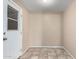 Neutral room with tile flooring and a white exterior door at 4740 W Bloomfield Rd, Glendale, AZ 85304