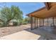 Spacious covered patio with lattice and gravel yard, perfect for outdoor gatherings and relaxation at 5204 E Colby St, Mesa, AZ 85205
