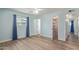 Bedroom featuring hardwood floors, a ceiling fan, and access to a closet at 5204 E Colby St, Mesa, AZ 85205