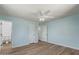 Spacious bedroom featuring a ceiling fan and hardwood floors at 5204 E Colby St, Mesa, AZ 85205