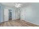 Bedroom featuring hardwood floors, a ceiling fan, and neutral paint at 5204 E Colby St, Mesa, AZ 85205