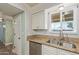 Bright kitchen with granite countertops, tile backsplash, and modern stainless steel appliances at 5204 E Colby St, Mesa, AZ 85205