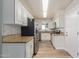 Bright kitchen with white cabinetry, stainless steel appliances, and hardwood floors at 5204 E Colby St, Mesa, AZ 85205