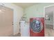 Well-equipped laundry room with washer, dryer, and water heater, offering convenience and efficiency at 5204 E Colby St, Mesa, AZ 85205