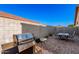 Spacious backyard featuring a grill, patio seating, and plenty of room for outdoor activities at 5524 E Garnet Cir, Mesa, AZ 85206