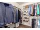 Spacious walk-in closet with clothing racks, shelves and a laundry basket at 5524 E Garnet Cir, Mesa, AZ 85206