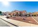 Charming single-story home with a three car garage, desert landscaping, and curb appeal at 5524 E Garnet Cir, Mesa, AZ 85206