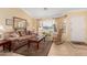 Inviting living room featuring a cozy sofa, wood accents, and ample natural light, perfect for relaxation at 5524 E Garnet Cir, Mesa, AZ 85206