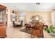 Cozy living room featuring tan walls, tile floors, and comfortable seating, creating a welcoming atmosphere at 5524 E Garnet Cir, Mesa, AZ 85206