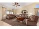 Spacious living room features comfortable seating, neutral colors, and ample natural light, creating a relaxing atmosphere at 5524 E Garnet Cir, Mesa, AZ 85206