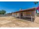 Backyard featuring a covered patio and block fence providing privacy at 6317 E Colby St, Mesa, AZ 85205