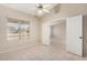 Bright bedroom with tiled floors, a ceiling fan, and ample natural light at 6317 E Colby St, Mesa, AZ 85205