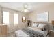 Cozy bedroom with a stylish bed, soft textures, and inviting decor for a restful retreat at 6317 E Colby St, Mesa, AZ 85205