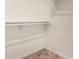 Walk-in closet featuring built in shelving and neutral paint at 6317 E Colby St, Mesa, AZ 85205