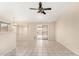 Bright dining area with tiled floors, a ceiling fan, and a sliding glass door to the backyard at 6317 E Colby St, Mesa, AZ 85205