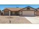 Charming single-story home with a well-maintained front yard and a two-car garage at 6317 E Colby St, Mesa, AZ 85205
