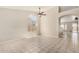 Bright and open living space with tile flooring, high ceilings, and large windows for natural light at 6317 E Colby St, Mesa, AZ 85205