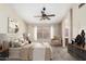 Serene main bedroom featuring a plush bed, soft lighting, and a calm, inviting ambiance at 6317 E Colby St, Mesa, AZ 85205