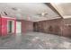 Spacious basement featuring vintage ceiling fans, exposed ductwork, and open layout at 6426 W Mulberry Dr, Phoenix, AZ 85033