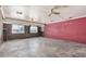 View of the unfinished basement with multiple windows and painted brick wall at 6426 W Mulberry Dr, Phoenix, AZ 85033