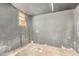 View of unfinished basement with black painted walls and a small window at 6426 W Mulberry Dr, Phoenix, AZ 85033
