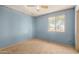 A view of the bedroom with blue walls and a window at 6426 W Mulberry Dr, Phoenix, AZ 85033