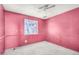 A view of the bedroom with pink walls and a window at 6426 W Mulberry Dr, Phoenix, AZ 85033