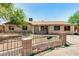 Charming single-story home featuring a stone facade, desert landscaping, and a decorative front fence at 6426 W Mulberry Dr, Phoenix, AZ 85033