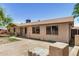 Single-story home featuring desert landscaping, a small tree, and a wide driveway at 6426 W Mulberry Dr, Phoenix, AZ 85033