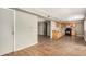 Spacious area connecting the kitchen to the living room, featuring wood cabinets and a laminate countertop at 6426 W Mulberry Dr, Phoenix, AZ 85033