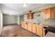 Kitchen featuring wood cabinets, laminate countertops, and black appliances at 6426 W Mulberry Dr, Phoenix, AZ 85033