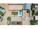 Aerial view of the backyard of a home featuring a large dirt area and a pool and patio at 7101 E Cholla St, Scottsdale, AZ 85254