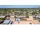 Aerial view of a home with a pool and grassy backyard in a desert neighborhood at 7101 E Cholla St, Scottsdale, AZ 85254