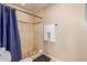 Bathroom featuring a walk-in shower, beige tile and white towels at 7101 E Cholla St, Scottsdale, AZ 85254