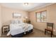 Bedroom featuring a queen bed, neutral tones and an exterior view at 7101 E Cholla St, Scottsdale, AZ 85254