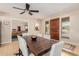 Elegant dining area with a modern table, stylish chairs, and a sleek ceiling fan at 7101 E Cholla St, Scottsdale, AZ 85254