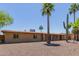 Desert home with mature palm trees, desert landscaping and a quaint entryway at 7101 E Cholla St, Scottsdale, AZ 85254