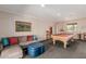 The game room includes a pool table, painting, sectional couch and brick accent wall at 7101 E Cholla St, Scottsdale, AZ 85254