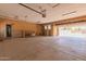 Spacious garage includes built-in shelving and access to both the home and the backyard at 7101 E Cholla St, Scottsdale, AZ 85254