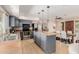 Stylish kitchen with granite countertops, stainless steel appliances, and a central island at 7101 E Cholla St, Scottsdale, AZ 85254