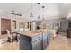 Open kitchen featuring a center island with granite countertop and dining area at 7101 E Cholla St, Scottsdale, AZ 85254